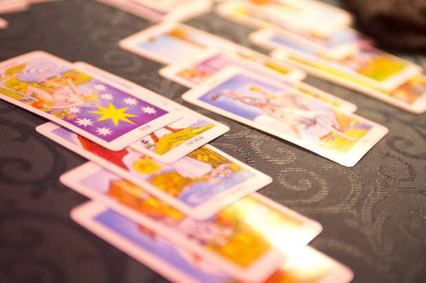A close-up of the tarot cards laid out during a ...